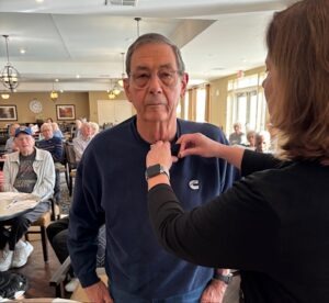 Army veteran receiving his pin
